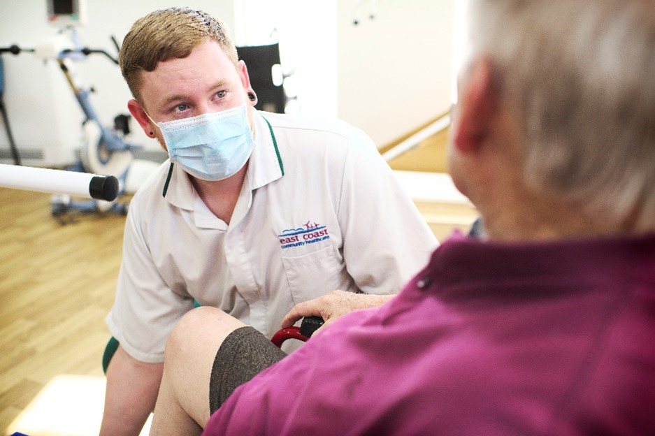 an occupational therapist assessing a patient