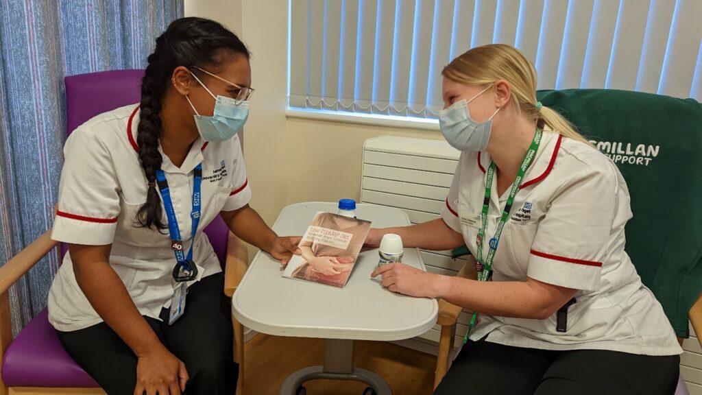 two dietitians looking at a leaflet