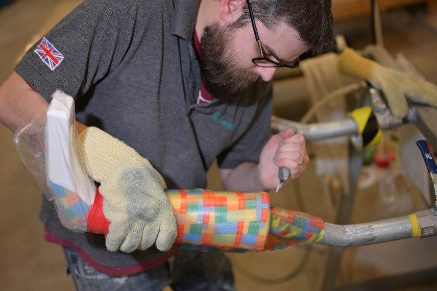 a prosthetist working on a prosthetic leg